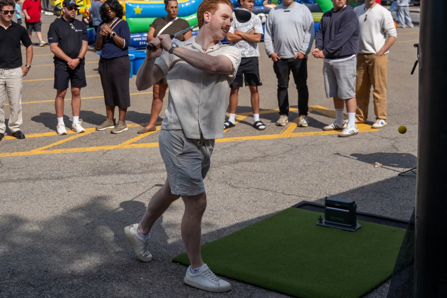 Golf Club Mobile simulator at an outdoor event with guests